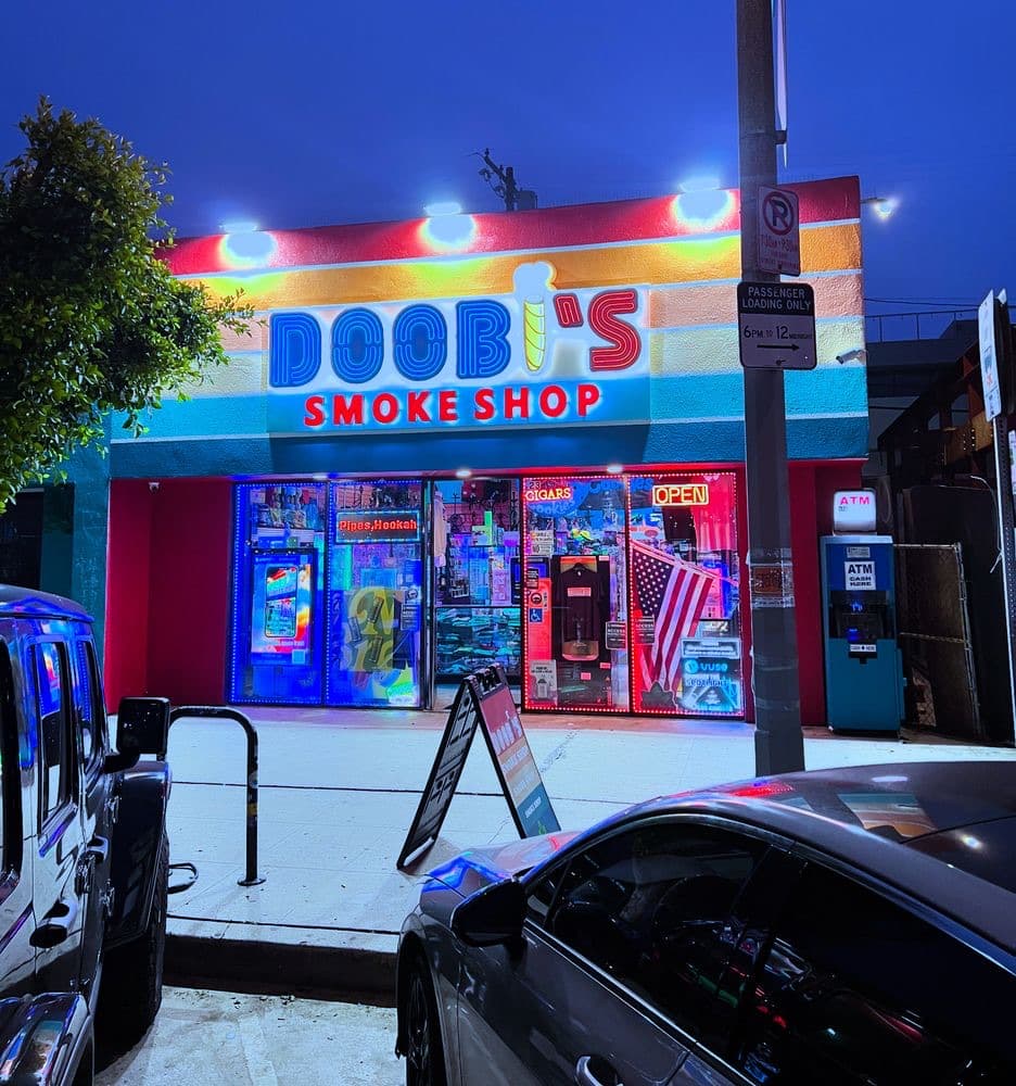 Doobi's Smoke Shop storefront at dusk on Washington Blvd, Marina del Rey